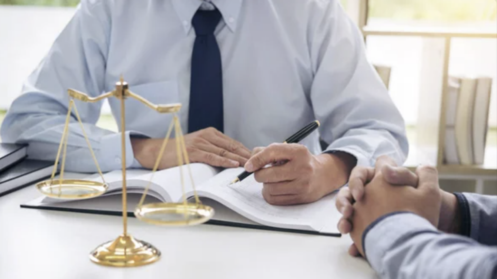 Personalized Attention and Direct Involvement from Solo Attorneys- an lawyer seating in front of client