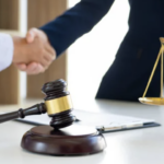 A LAWYER SHAKING HANDS WITH A client