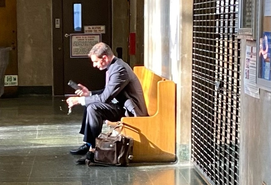NYC Defense Attorney waiting in court