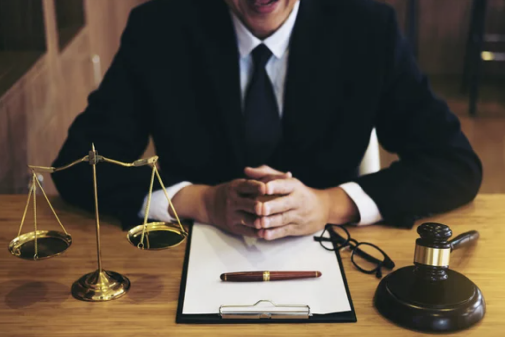 NYC Lawyer seating with client discussing possibilities