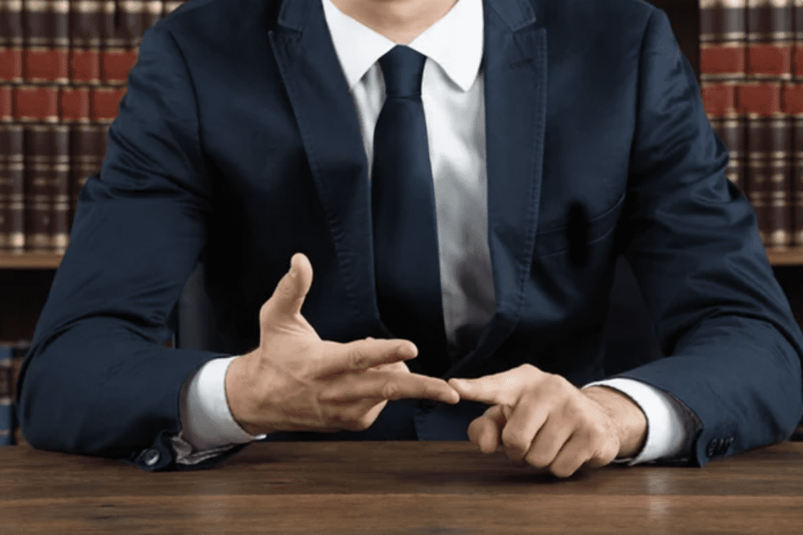New York defense Lawyer showing with fingers steps on a trial