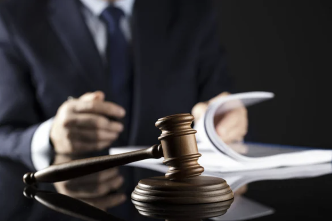 Defense Lawyer reading papers