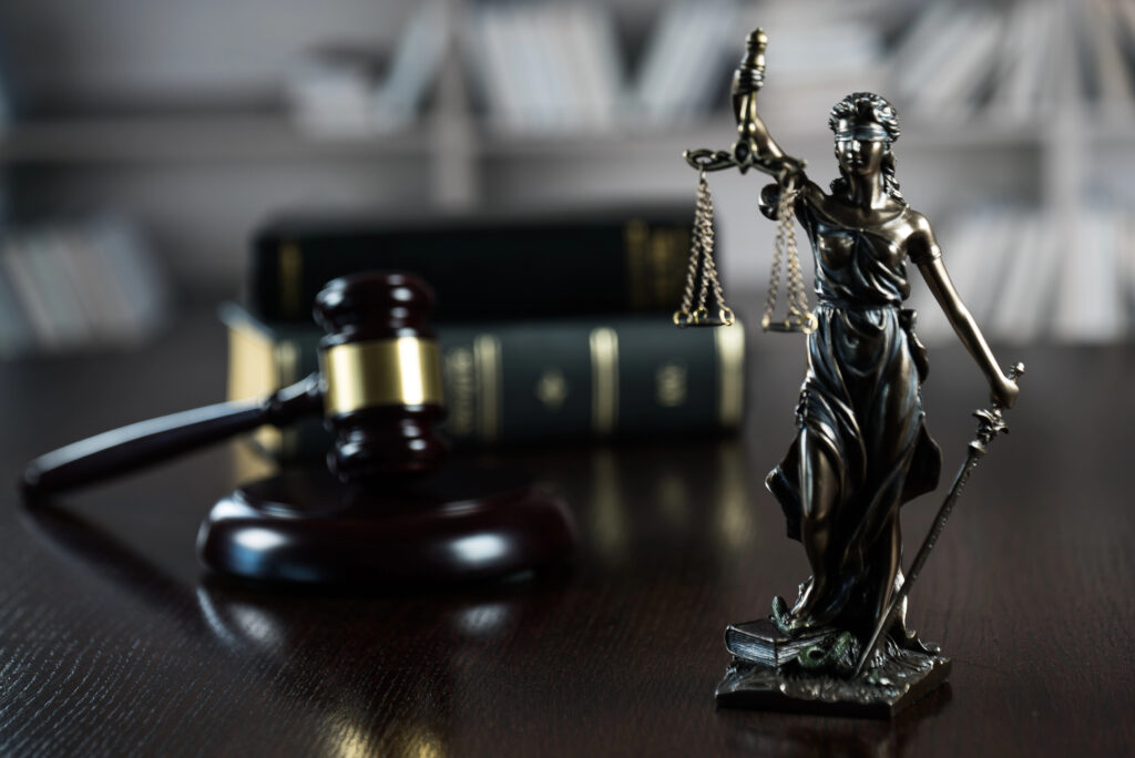 New York Embezzlement Lawyer desk showing justice