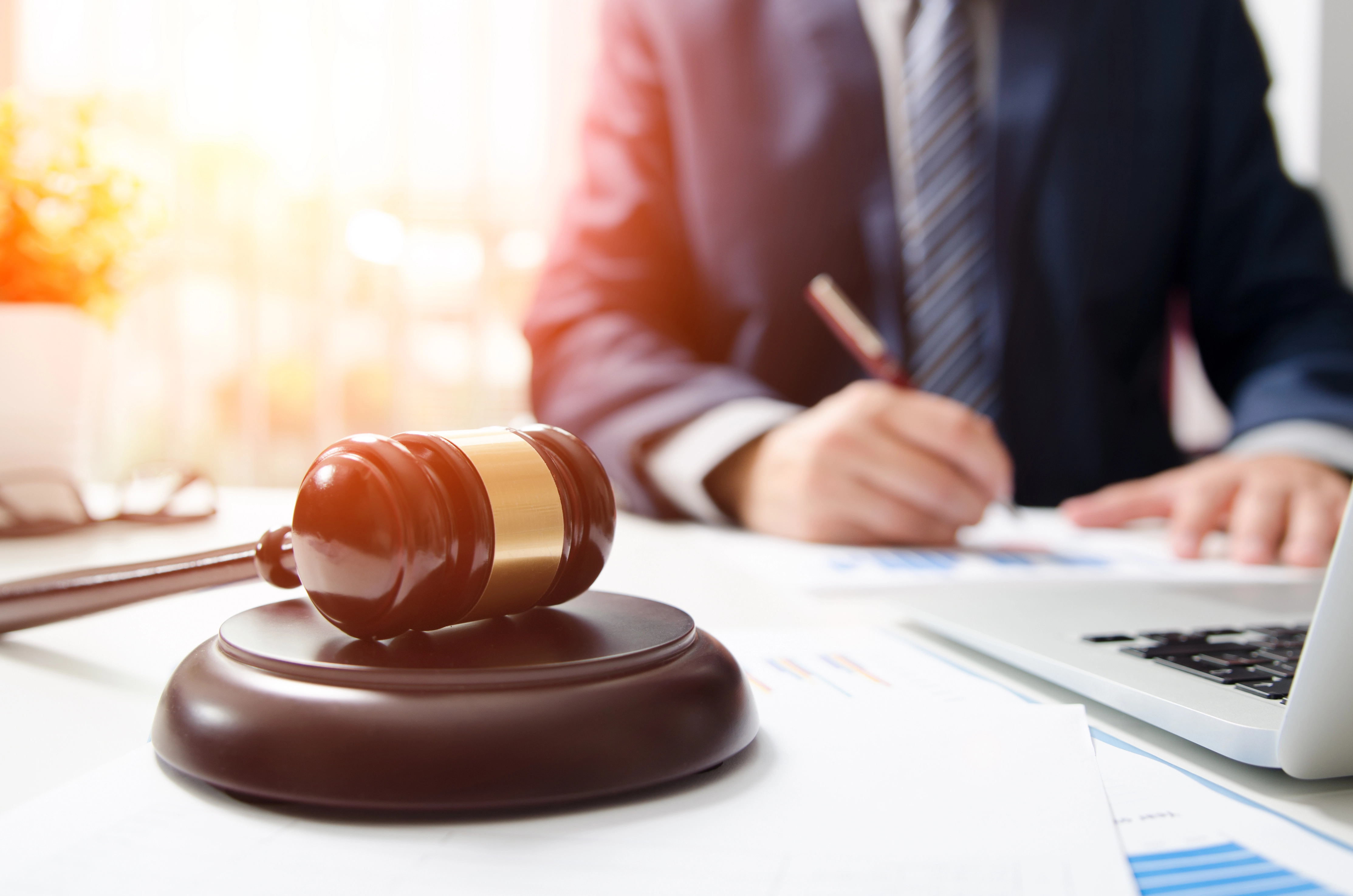 embezzlement lawyer working at his desk